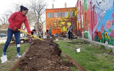Women gardening outside a housing cooperative