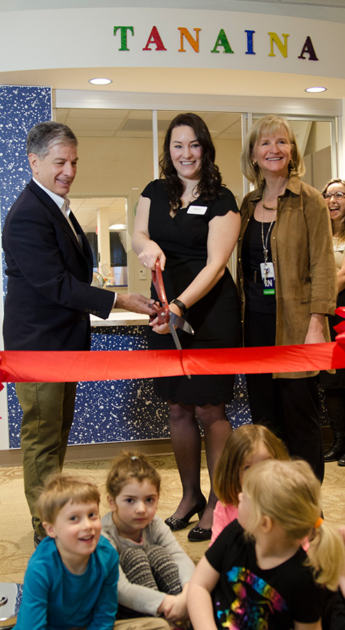 people cutting a ribbon