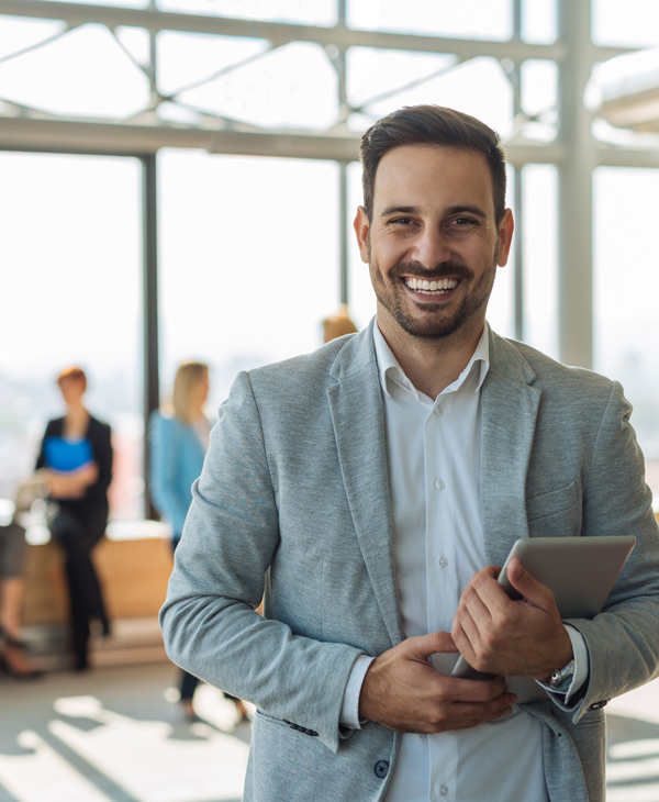 happy man at bank with tablet